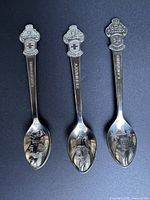 Three Rolex Bucherer souvenir spoons showing full view