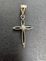 Full view of white gold crucifix pendant