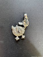Front view of silver-tone duck pendant with pavé crystals and faceted crystal head