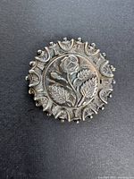 Front view showing floral motif and decorative rim