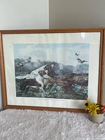 Full view of framed Currier & Ives Hunting Scene print on surface