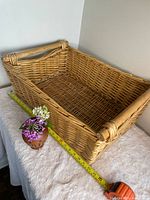 angled full view showing basket shape, weave and measuring tape