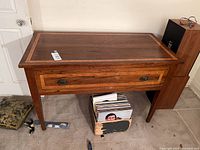 Front view of mahogany sideboard showing drawer and overall form