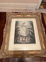 Full view of framed print showing ornate gilt frame and matting