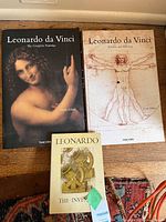 All three Leonardo da Vinci art books laid out