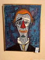 Front view of framed clown oil painting