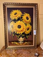 Full view of framed sunflower painting