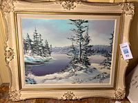 Full view of framed winter landscape painting