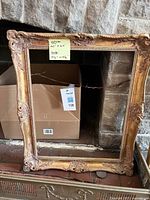 Full view of first ornate gold frame with dimension note