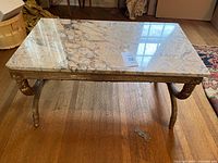 Full view of marble-top coffee table