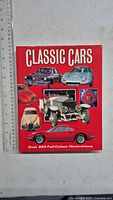 Front cover of Classic Cars book beside ruler