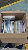 Open box showing full assortment of DVD cases