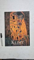 Front cover of the Klimt art book with marker for scale