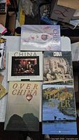 All five large China books laid on table