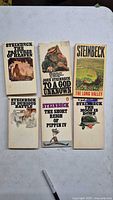 Front covers of all six Steinbeck paperbacks