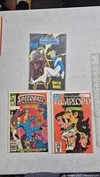Front covers of the three comic books