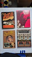 Front covers of all four Sherlock Holmes books