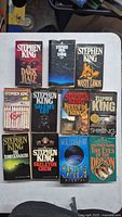 Front covers laid out showing all eleven Stephen King paperbacks