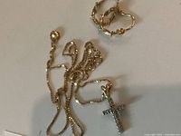 14k hoop earrings and 10k chain with cross pendant overview
