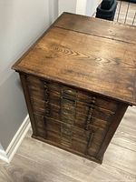 Cabinet top and right side showing wood grain and scale