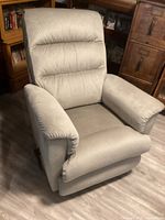 Front three-quarter view of recliner showing overall design and fabric
