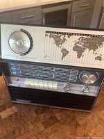 Front view showing entire Eversonic multi-band world time radio with world time dial and map