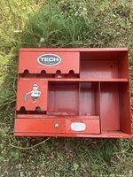 Front view of red Tech Tire Repairs organizer showing overall structure and compartments