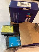 Opened NSK 962XL combo pack showing cartridges