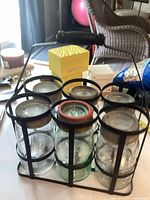 Front view of carrier holding six jars