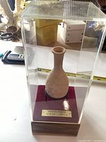 Jug in display case full view