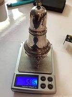 Caster on scale reading 56.5 g