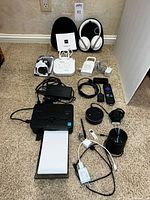 All items laid out including headphones, printer, monitors, Roku, Echo Dot, cables
