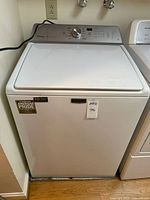 Full front view of white Maytag Bravos XL top-load washer