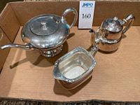 All three silverplate pieces grouped in box