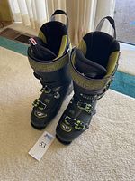 Front view of both Tecnica Cochise 120 boots standing upright showing buckles and liners