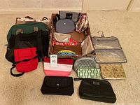 Overview of all bags arranged on floor and inside box