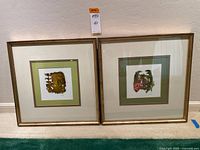 Both framed watercolors side by side