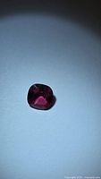 Front view of cushion cut spinel showing color
