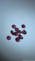 Top view of all garnet gemstones on neutral background