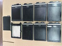 Eight film holders, dark slide and view screen shown front view