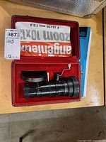 Lens, shade and case interior showing Angénieux branding