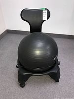 Complete chair assembled with ball, backrest, base, tag visible