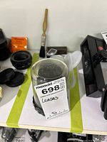 Nikon Printing-Nikkor lens in clear plastic case with auction sticker visible