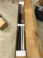 Screen components in original box with foam inserts