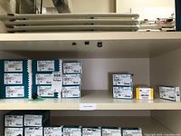 Shelf with multiple Spaenaur and other hardware boxes