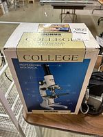 Sealed Konus College microscope box on table