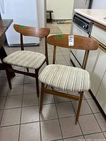 Both chairs front view showing design and upholstery