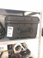 Hard plastic carry case on shelf