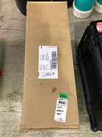 Sealed cardboard carton with shipping label and lot sticker