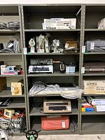 Front view of full metal shelving unit with six shelves